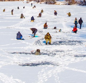 Ice fishing the frozen river